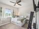 Bedroom with a view, a built in bed and vanity, and a peaceful color scheme at 6617 Park Strand Dr, Apollo Beach, FL 33572