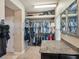 Spacious walk-in closet with custom shelving and countertop for organization at 6617 Park Strand Dr, Apollo Beach, FL 33572