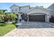 Charming two-story home with a two-car garage and a well-manicured front yard at 6617 Park Strand Dr, Apollo Beach, FL 33572