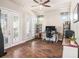 Home office with ceiling fan and french doors provides plenty of natural light at 6617 Park Strand Dr, Apollo Beach, FL 33572