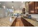 Spacious kitchen with stainless steel appliances, granite countertops, and island at 6617 Park Strand Dr, Apollo Beach, FL 33572