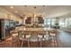 Open-concept kitchen features stainless steel appliances, a large island, and stylish pendant lighting at 6617 Park Strand Dr, Apollo Beach, FL 33572