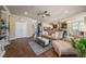 Spacious living area seamlessly flows into a modern kitchen, featuring hardwood floors and an abundance of natural light at 6617 Park Strand Dr, Apollo Beach, FL 33572