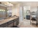 Luxurious main bathroom featuring granite countertops, ample storage, and a glass shower at 6617 Park Strand Dr, Apollo Beach, FL 33572