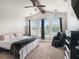 Bright and airy main bedroom with a vaulted ceiling, large windows, and comfortable seating area at 6617 Park Strand Dr, Apollo Beach, FL 33572