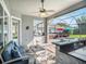 Inviting outdoor living space with a bar, jacuzzi, and comfortable seating, perfect for relaxation and gatherings at 6617 Park Strand Dr, Apollo Beach, FL 33572