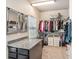 Spacious walk-in closet with custom shelving, drawers, and storage solutions at 6617 Park Strand Dr, Apollo Beach, FL 33572