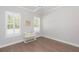 Bedroom with white trim, hard wood floors, and bright natural light at 6644 Par Ct, Wesley Chapel, FL 33544