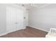 Bright bedroom with white trim, hard wood floors, and bright natural light at 6644 Par Ct, Wesley Chapel, FL 33544