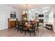 Elegant dining room with wood floors, coffered ceiling, and stylish furnishings, perfect for entertaining at 6644 Par Ct, Wesley Chapel, FL 33544