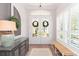 Bright foyer with natural light, double doors with wreaths, and stylish decor, creating a warm welcome at 6644 Par Ct, Wesley Chapel, FL 33544