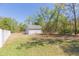 Detached garage offering ample space for parking and storage, set in a spacious backyard at 6644 Par Ct, Wesley Chapel, FL 33544