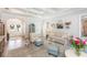 Elegant living room with a view of the foyer, comfortable seating, and sophisticated decor at 6644 Par Ct, Wesley Chapel, FL 33544