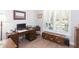 Home office with a desk, window shutters, and storage provides a quiet workspace at 6644 Par Ct, Wesley Chapel, FL 33544