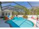 Gorgeous pool features refreshing blue water, screened enclosure, attractive landscaping, and play area at 6644 Par Ct, Wesley Chapel, FL 33544