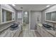 Stylish bathroom with dual vessel sinks, granite countertops, and a coordinated design scheme at 700 Starkey Rd # 514, Largo, FL 33771