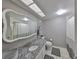 Updated bathroom boasts a decorative mirror, granite countertop, and tiled shower at 700 Starkey Rd # 514, Largo, FL 33771