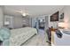 Bright bedroom with a ceiling fan, and sliding glass doors that lead to the outdoor living space at 700 Starkey Rd # 514, Largo, FL 33771
