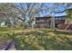 Charming condo with mature landscaping and a screened balcony overlooking a lush, green lawn at 700 Starkey Rd # 514, Largo, FL 33771