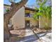 Two-story condo featuring a private balcony, a well-maintained walkway, and lush tropical landscaping at 700 Starkey Rd # 514, Largo, FL 33771