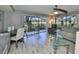 Inviting living room with a ceiling fan, clear windows to an outdoor view, and comfortable seating arrangements at 700 Starkey Rd # 514, Largo, FL 33771
