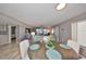 Open-concept living area featuring modern flooring, stylish decor, and a scenic view to the outdoors at 700 Starkey Rd # 514, Largo, FL 33771