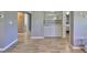 Open-concept living space with hardwood flooring and a built-in dry bar area at 700 Starkey Rd # 514, Largo, FL 33771