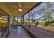 Relaxing screened-in patio with ceiling fan and a beautiful view of lush greenery and the golf course at 700 Starkey Rd # 514, Largo, FL 33771