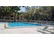 Community pool with lounge chairs for relaxing and enjoying the Florida sunshine at 700 Starkey Rd # 514, Largo, FL 33771