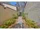Beautiful walkway leads to the condo entrance, enhanced by lush landscaping and mature trees at 700 Starkey Rd # 514, Largo, FL 33771