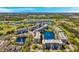 Beautiful aerial view of condos surrounded by lakes, a golf course, and lush greenery at 960 Starkey Rd # 5303, Largo, FL 33771