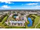 An aerial view of a beautiful condo community surrounded by lush greenery, lakes, and a golf course at 960 Starkey Rd # 5303, Largo, FL 33771