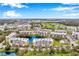 Beautiful aerial view of the condos with the lake, golf course, and lush greenery at 960 Starkey Rd # 5303, Largo, FL 33771