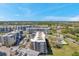 An aerial shot captures the condo buildings, parking area and surrounding lush landscape at 960 Starkey Rd # 5303, Largo, FL 33771