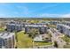 Aerial view of condominium buildings, pool, parking and landscape at 960 Starkey Rd # 5303, Largo, FL 33771