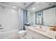 Bright bathroom featuring a bathtub with shower and a sink with decorative accents at 960 Starkey Rd # 5303, Largo, FL 33771