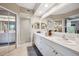 Spacious bathroom featuring double sinks, a glass shower, and ample storage at 960 Starkey Rd # 5303, Largo, FL 33771