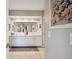 Bathroom with double sinks, large mirror and decorative artwork at 960 Starkey Rd # 5303, Largo, FL 33771
