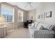 Bright room with two windows, work space and seating featuring a comfortable sofa at 960 Starkey Rd # 5303, Largo, FL 33771
