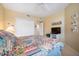 Bright bedroom with a ceiling fan, closet and decoratively patterned bedspread at 960 Starkey Rd # 5303, Largo, FL 33771