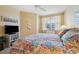 Cozy bedroom with bright walls, natural light, ceiling fan and a comfortable bed at 960 Starkey Rd # 5303, Largo, FL 33771