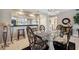 Bright dining room with glass table, elegant chairs, and stylish chandelier at 960 Starkey Rd # 5303, Largo, FL 33771