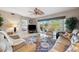 Bright living room with comfortable seating, a ceiling fan, and a sliding glass door offering lovely outdoor views at 960 Starkey Rd # 5303, Largo, FL 33771