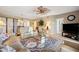 A well-decorated living room featuring comfortable seating, a ceiling fan, and an open layout with other living spaces at 960 Starkey Rd # 5303, Largo, FL 33771