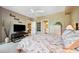 Spacious bedroom with ceiling fan, TV, and access to the ensuite bathroom and living room at 960 Starkey Rd # 5303, Largo, FL 33771
