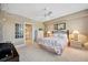 Serene bedroom with a ceiling fan, decor, and an en-suite bathroom entrance at 960 Starkey Rd # 5303, Largo, FL 33771