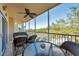 View from a screened-in patio featuring an outdoor dining table at 960 Starkey Rd # 5303, Largo, FL 33771