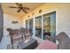 Relaxing screened-in patio with comfortable wicker furniture and a ceiling fan at 960 Starkey Rd # 5303, Largo, FL 33771
