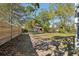 View of the backyard showing a privacy fence and foliage at 1004 E 22Nd Ave, Tampa, FL 33605