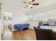 Bright bedroom featuring a ceiling fan, hardwood floors, and sunny windows, creating a relaxing atmosphere at 1004 E 22Nd Ave, Tampa, FL 33605